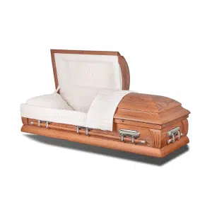 The Kennedy Oak Wood Casket, featuring a partially open lid and lined with white cushioned fabric and decorative pleating, is shown against a plain white background.