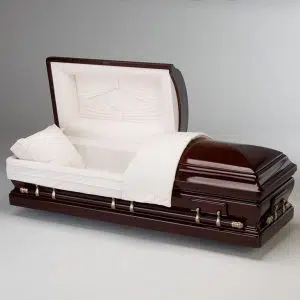 A polished dark wood casket with a white cushioned interior and gold handles, shown open in a studio setting on a plain white background.
