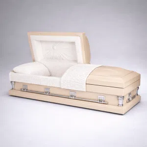 Cashmere casket shown open at an angle, tan exterior with a white crepe interior, pleated sunburst lid panel, matching pillow and throw, and chrome bar handles.