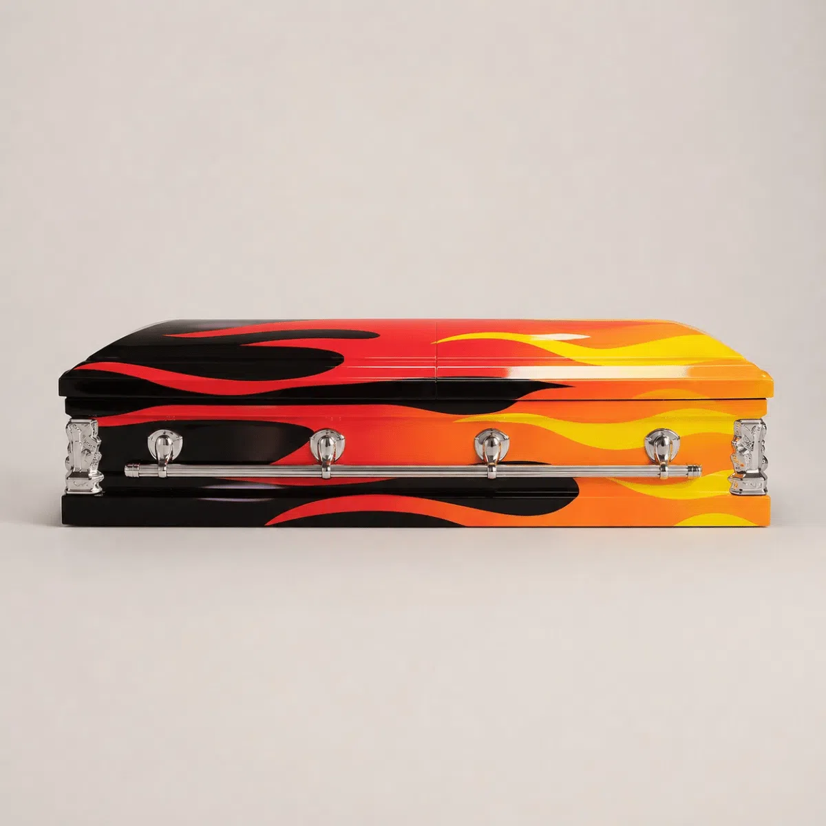 Custom Flame Casket – Side View Custom red orange and black flame casket with silver hardware