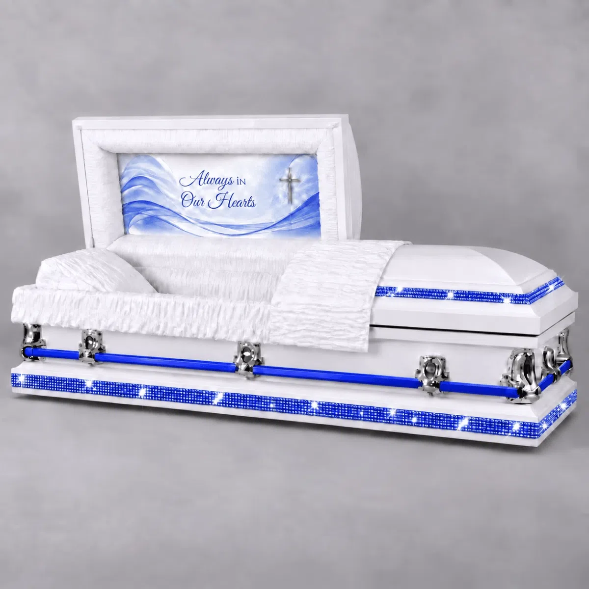 Blue Rhinestone Royalty Custom Casket White custom casket with blue rhinestone trim, blue handle bars, white interior and blue memorial head panel