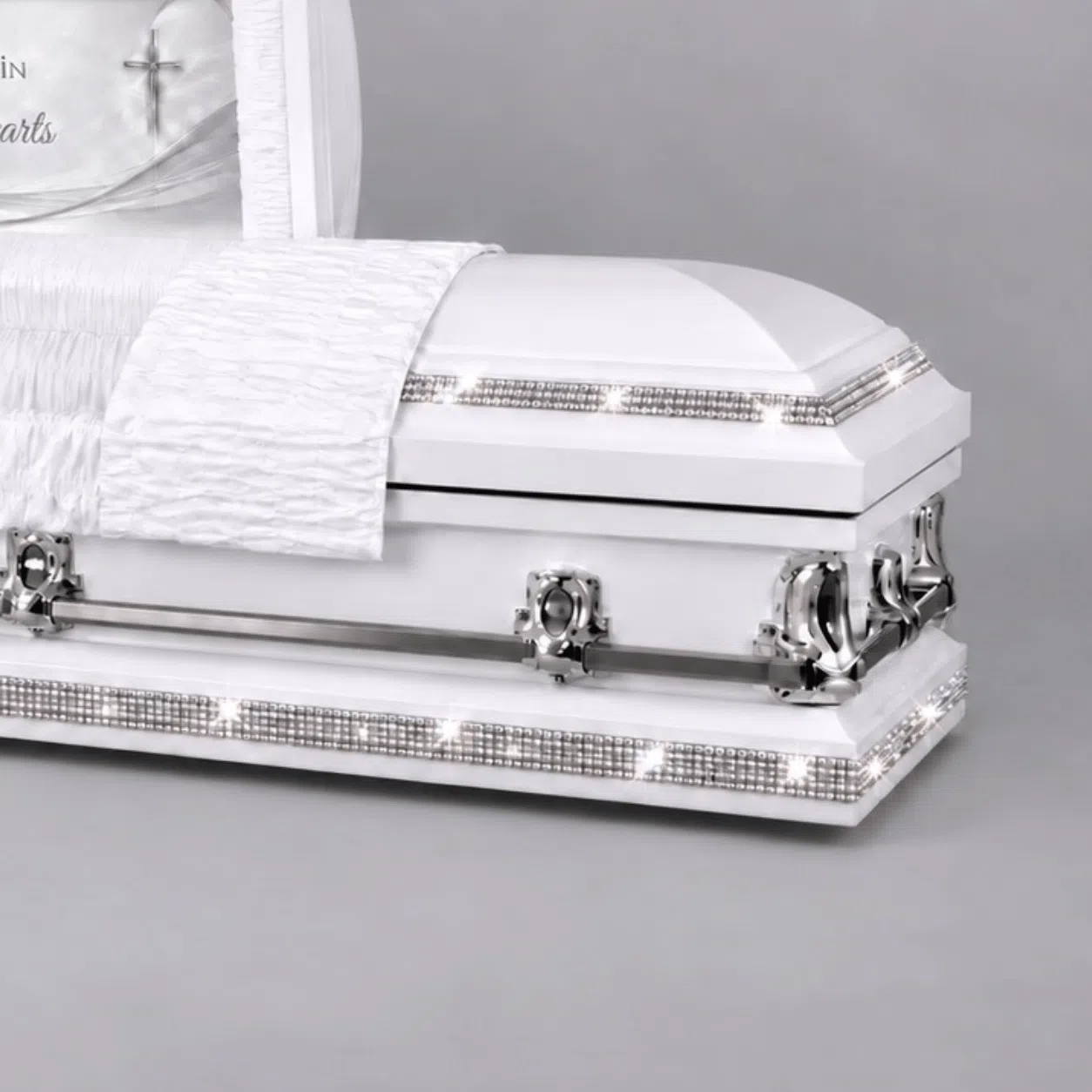 White Rhinestone Royalty Custom Casket White custom casket with silver rhinestone trim around the lid and lower base